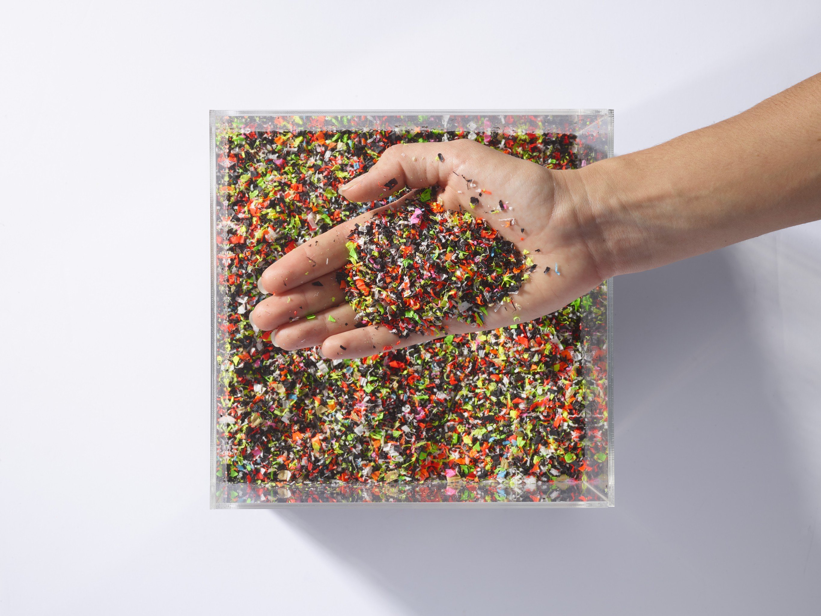 ABS - flakes - hand in tray